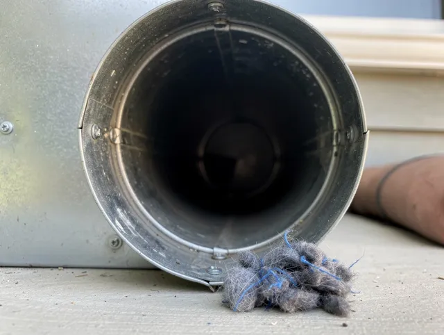 Horizon West Dryer Vent Cleaning technician using specialized equipment to clear severe dryer vent blockage in Horizon West